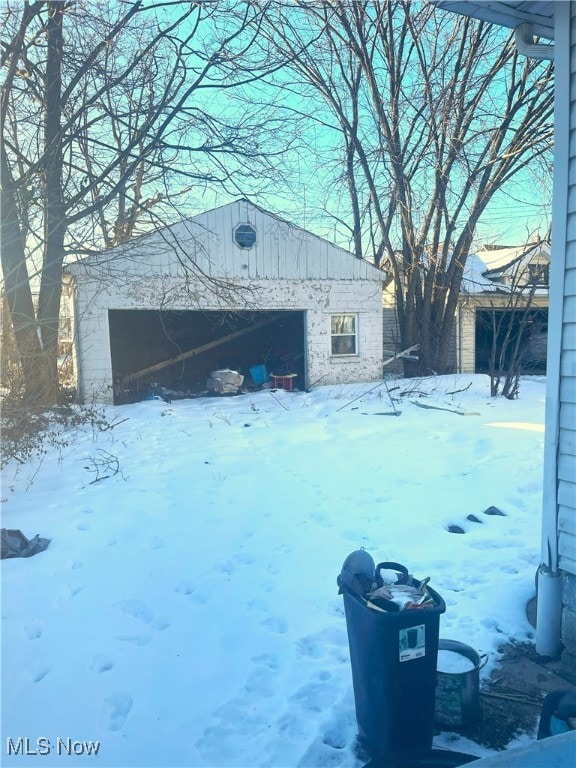 view of snow covered garage