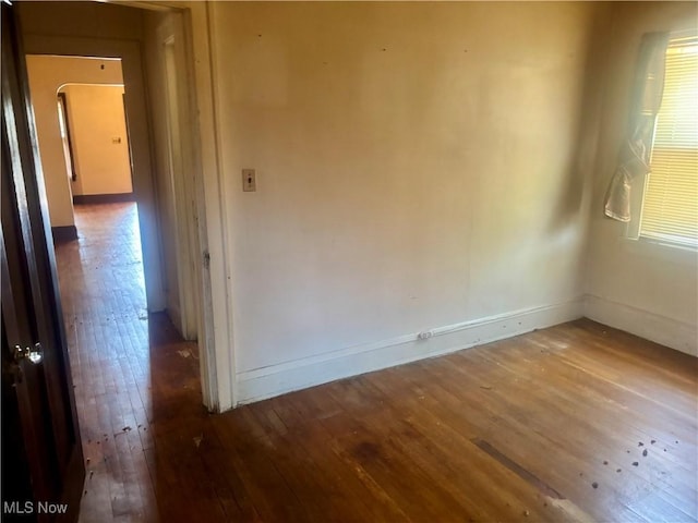 1245 E 137th St, East Cleveland, OH 44112 - empty room featuring baseboards and wood-type flooring