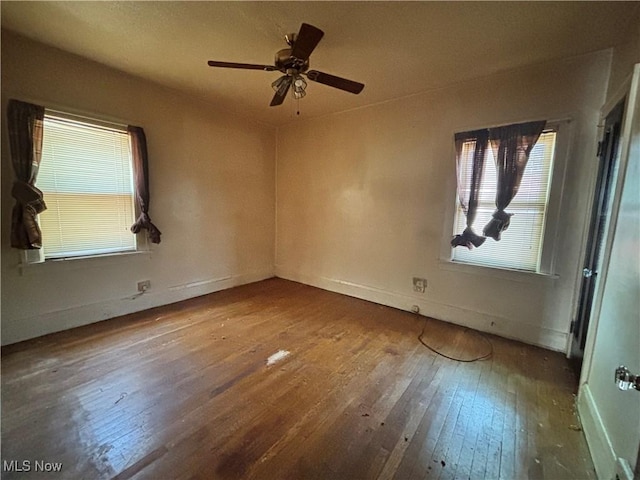 1245 E 137th St, East Cleveland, OH 44112 - spare room featuring baseboards, ceiling fan, and hardwood / wood-style flooring
