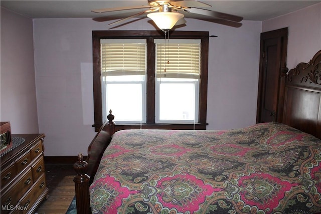 bedroom featuring ceiling fan and dark hardwood / wood-style floors