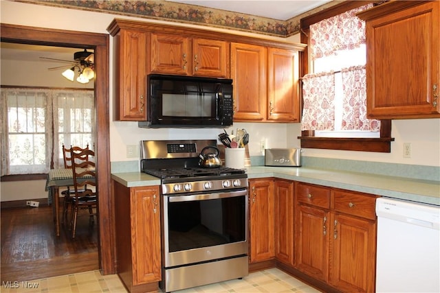 kitchen featuring ceiling fan, dishwasher, and stainless steel gas range oven