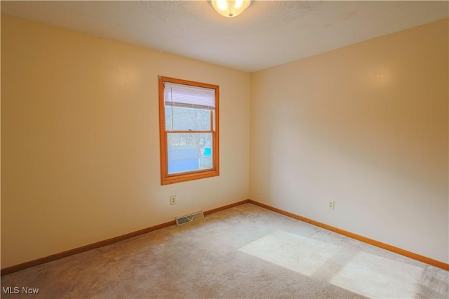 spare room with carpet floors