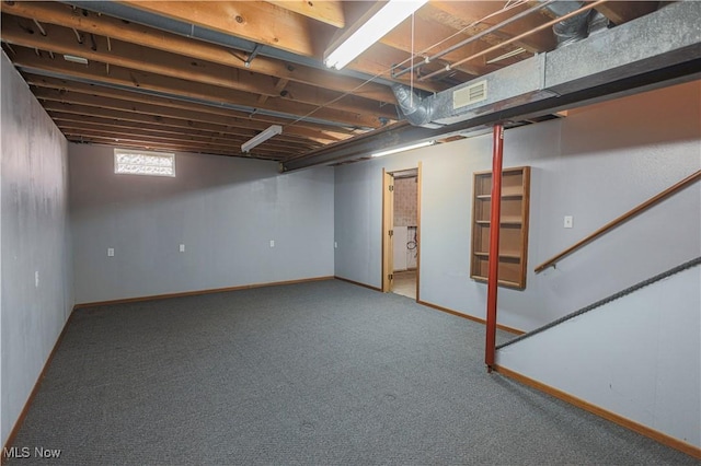 basement featuring carpet flooring