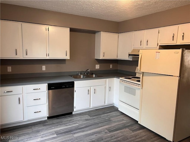 kitchen featuring white cabinetry, dark hardwood / wood-style flooring, sink, and white appliances