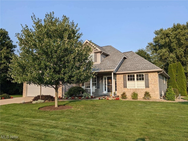 view of front facade featuring a garage and a front lawn