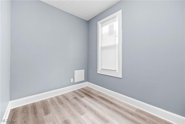 unfurnished room featuring light wood-type flooring