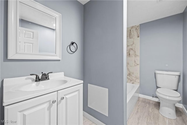 full bathroom with vanity, wood-type flooring, toilet, and shower / bath combination