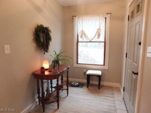 living area with light tile patterned floors