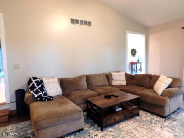 living room with vaulted ceiling