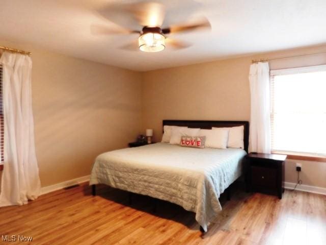 bedroom featuring ceiling fan and light wood-type flooring