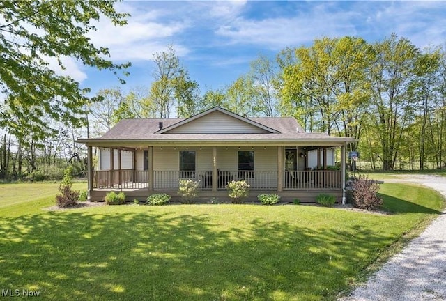 farmhouse with a front lawn and covered porch