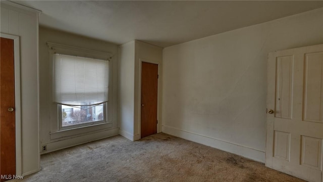 unfurnished bedroom with light colored carpet