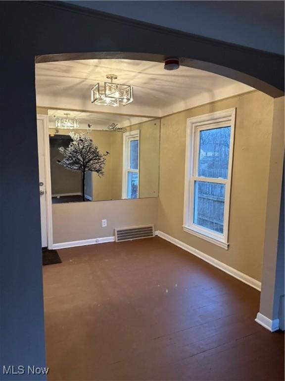 unfurnished room featuring dark hardwood / wood-style flooring