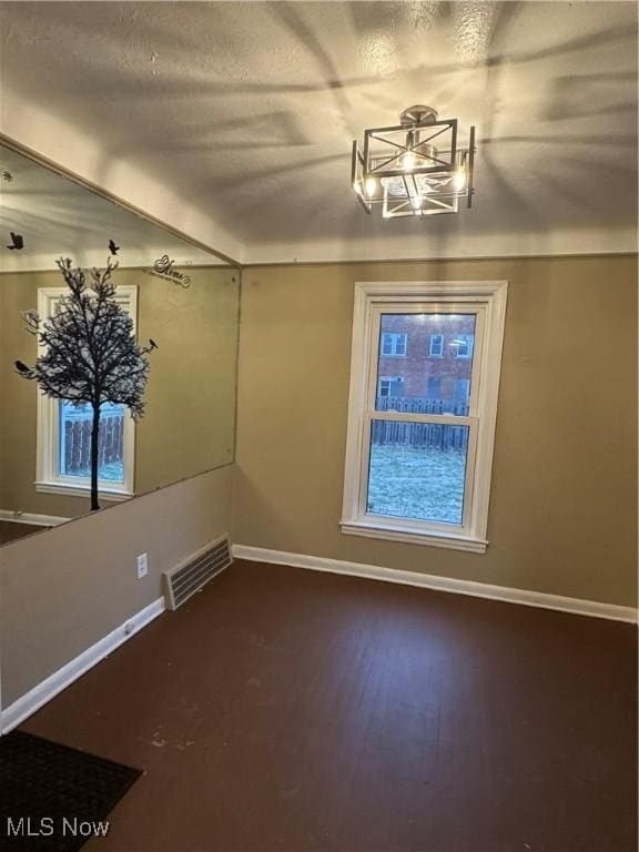 unfurnished dining area with wood-type flooring