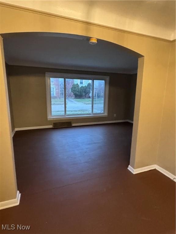 empty room featuring dark hardwood / wood-style floors