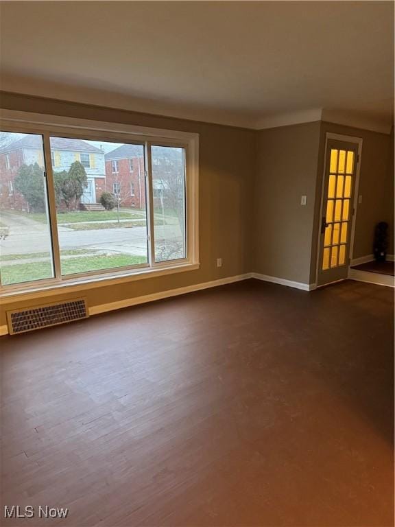 empty room featuring hardwood / wood-style flooring