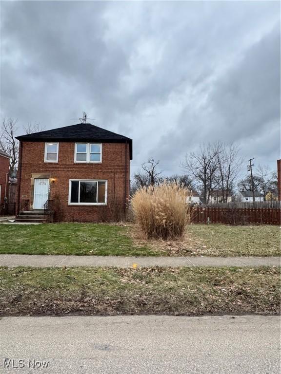 view of side of home featuring a yard