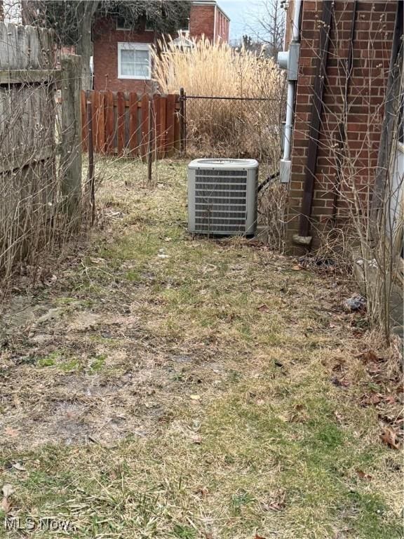 view of yard with central air condition unit