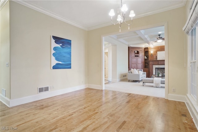 unfurnished living room featuring ceiling fan with notable chandelier, beamed ceiling, ornamental molding, coffered ceiling, and light wood-type flooring