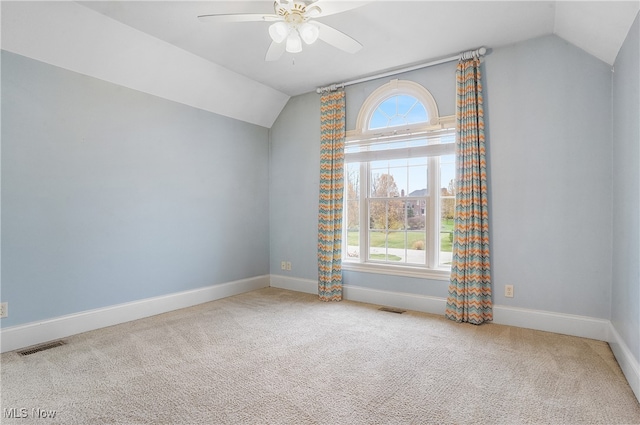 bonus room with vaulted ceiling, carpet flooring, and ceiling fan