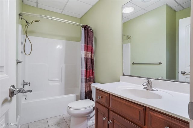 full bathroom with toilet, vanity, shower / bath combo, tile patterned flooring, and a drop ceiling