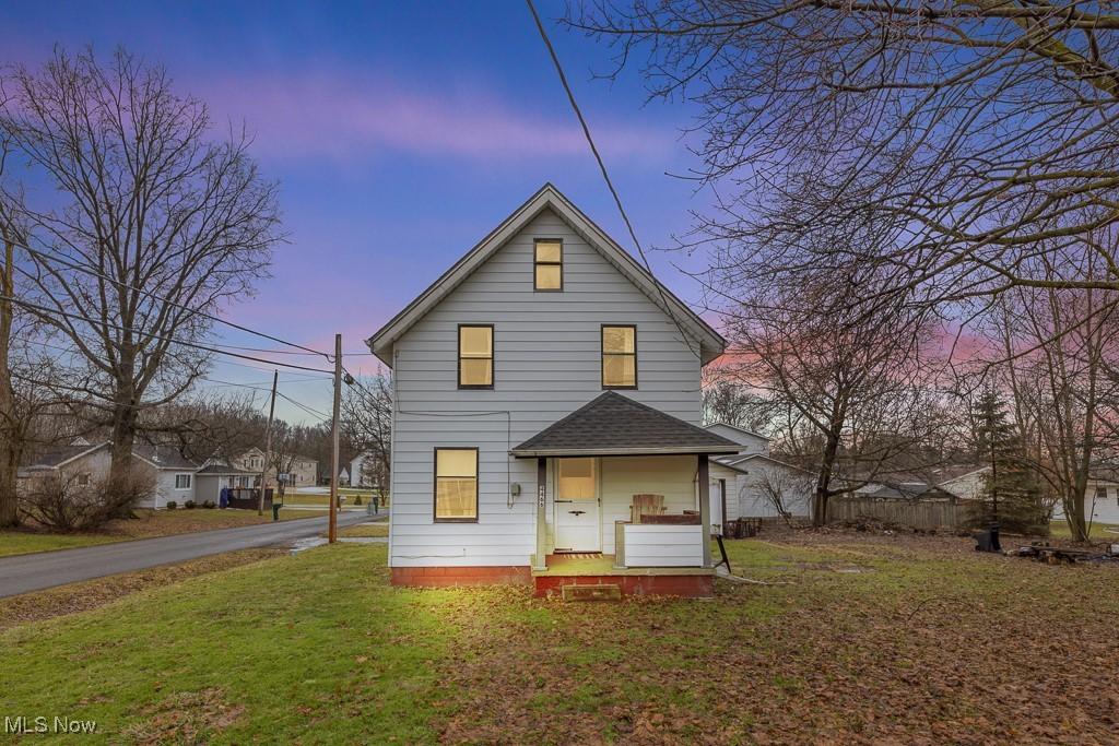 view of front facade with a yard and a porch