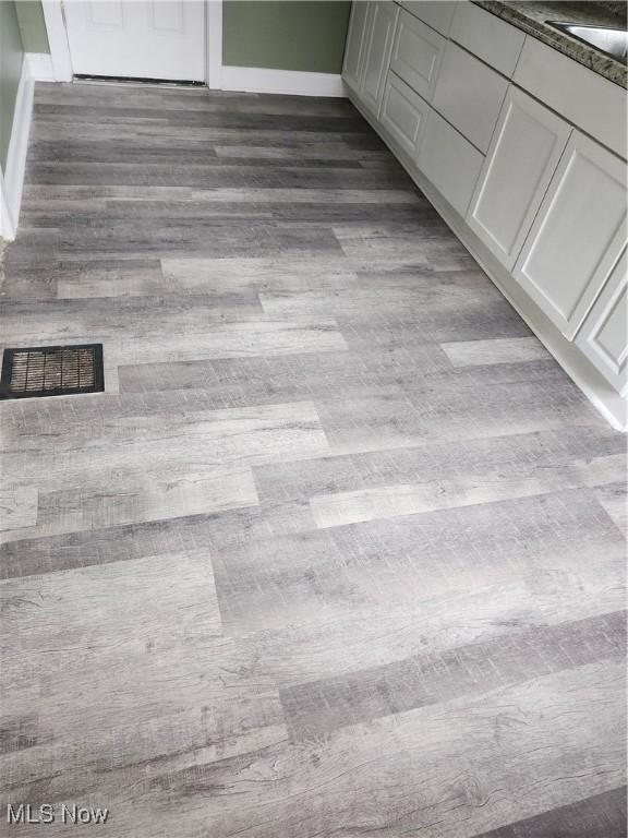 interior details featuring hardwood / wood-style flooring