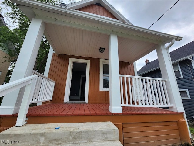 doorway to property featuring a porch