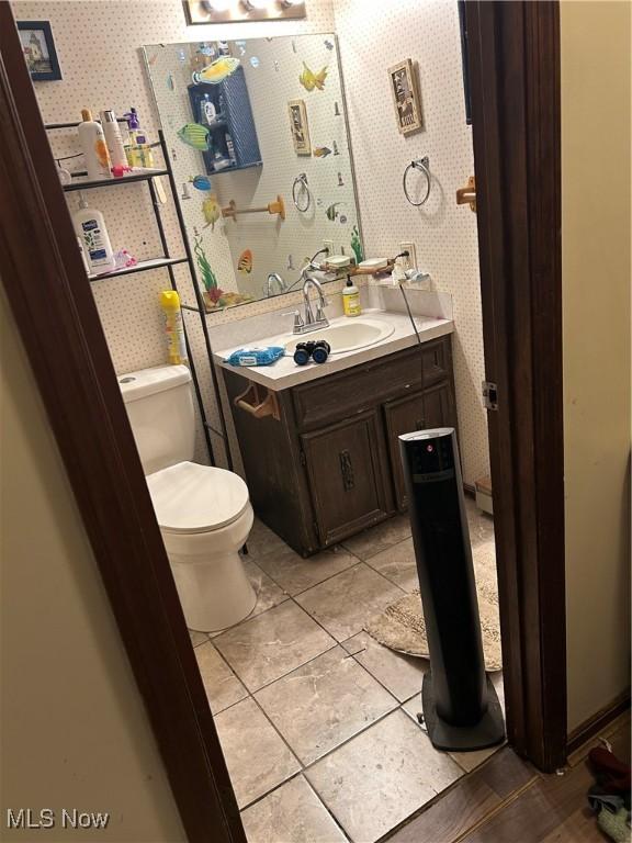 bathroom with vanity and toilet