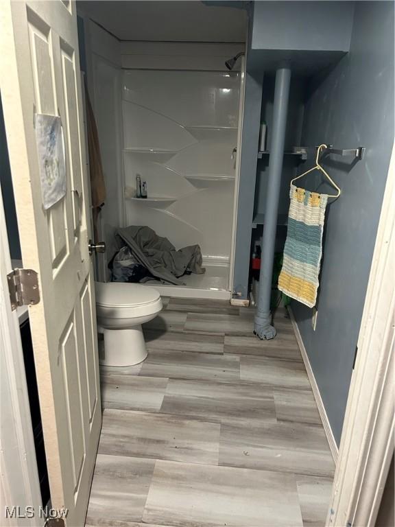 bathroom featuring toilet and hardwood / wood-style floors