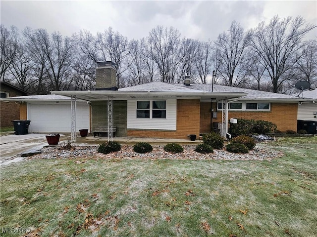 ranch-style house with a garage, a front yard, and a carport