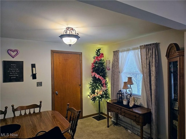 view of carpeted dining area