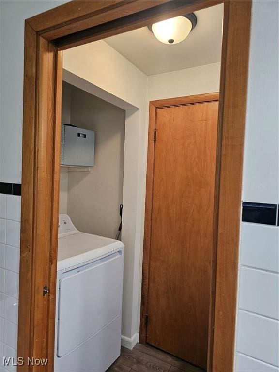 laundry area with dark hardwood / wood-style flooring and washer / clothes dryer