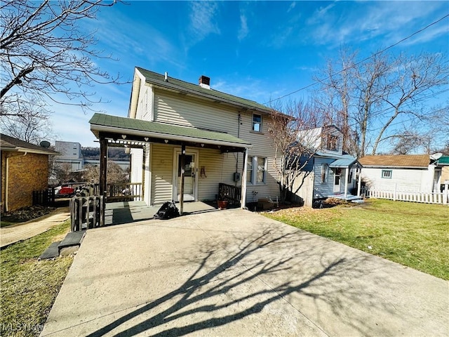 view of front of home with a porch and a front yard