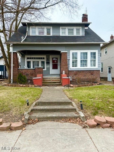 view of front of home with a front yard