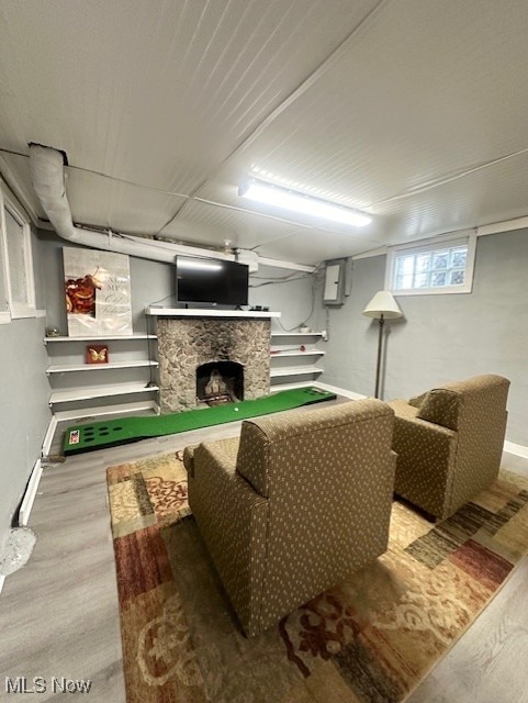 living room featuring hardwood / wood-style flooring and a fireplace