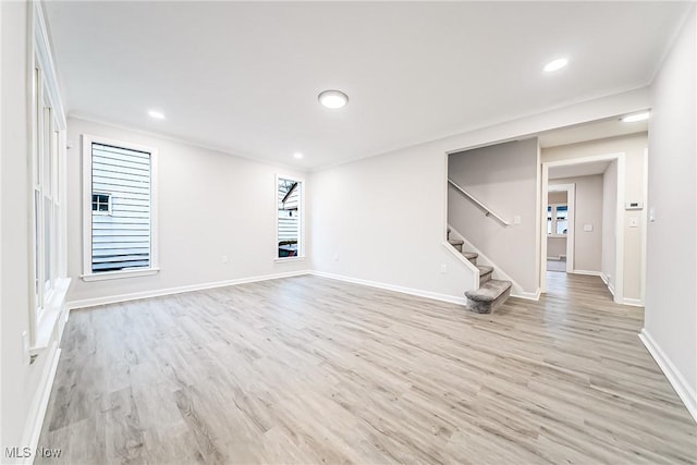 unfurnished living room with light hardwood / wood-style floors