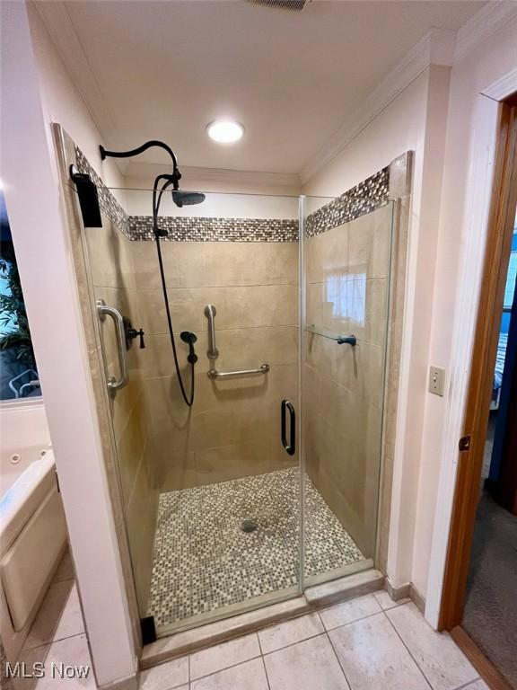 bathroom with crown molding, tile patterned floors, and plus walk in shower