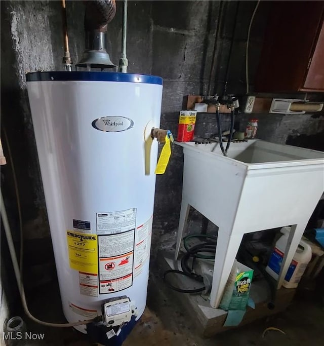 utility room featuring gas water heater