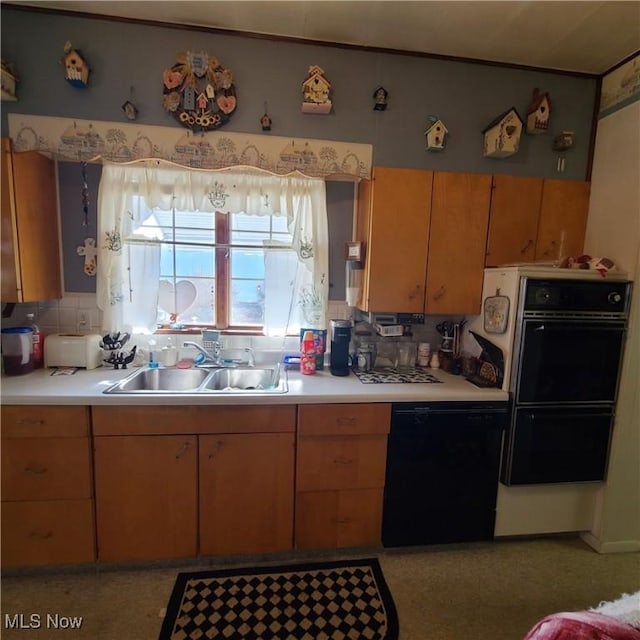 kitchen featuring tasteful backsplash, sink, and black appliances