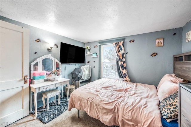 carpeted bedroom with a textured ceiling