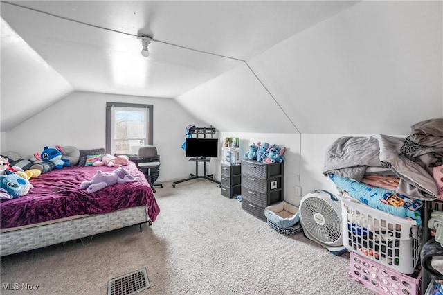 carpeted bedroom featuring vaulted ceiling