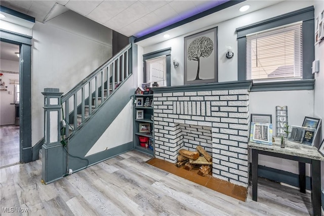 staircase with hardwood / wood-style flooring