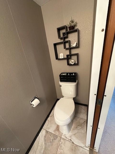 bathroom featuring toilet