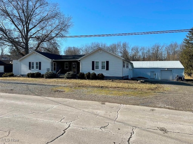 single story home featuring a garage