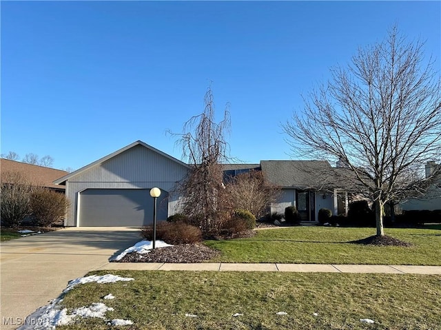 single story home featuring a garage and a front yard