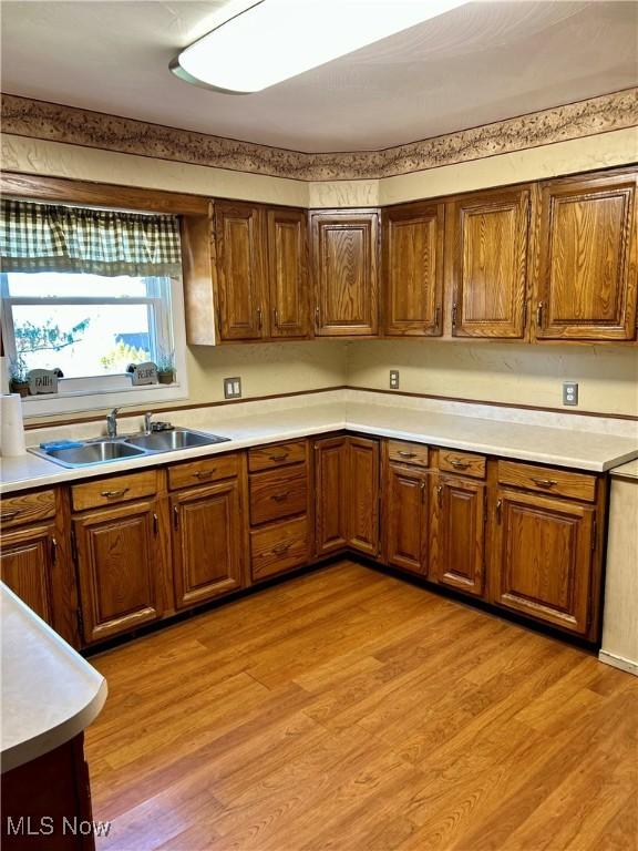 130 Rauch Dr, Marietta, OH 45750 - kitchen featuring sink and light hardwood / wood-style floors
