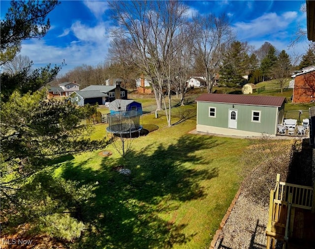 130 Rauch Dr, Marietta, OH 45750 - view of yard featuring an outdoor structure and a trampoline