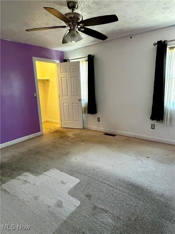 130 Rauch Dr, Marietta, OH 45750 - unfurnished room with ceiling fan, carpet, and a textured ceiling