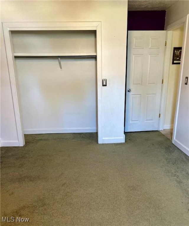 130 Rauch Dr, Marietta, OH 45750 - unfurnished bedroom with dark carpet and a closet